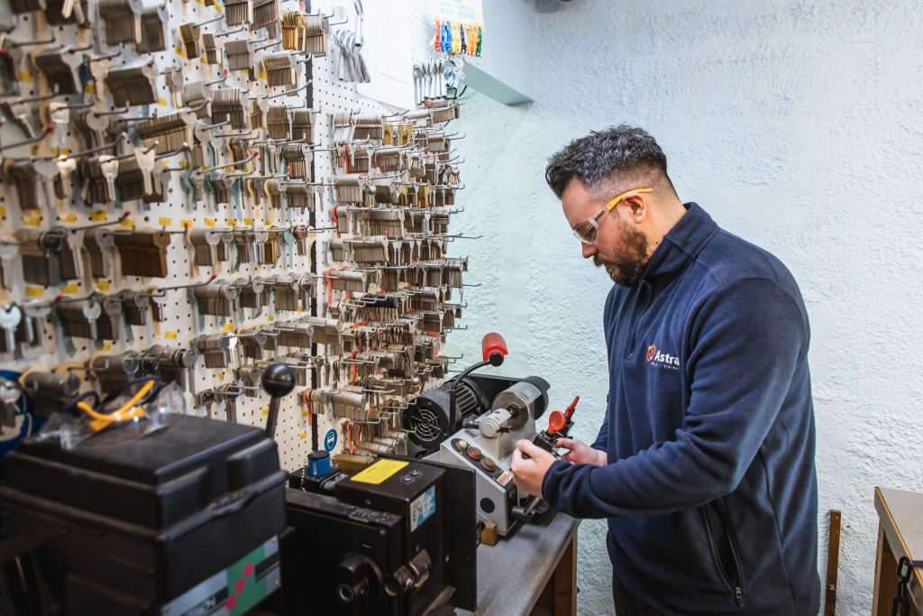 man cutting keys